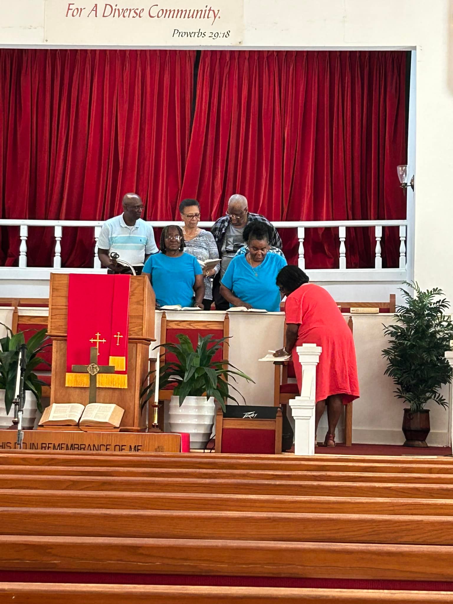FABC choir rehearsing around the pulpit area