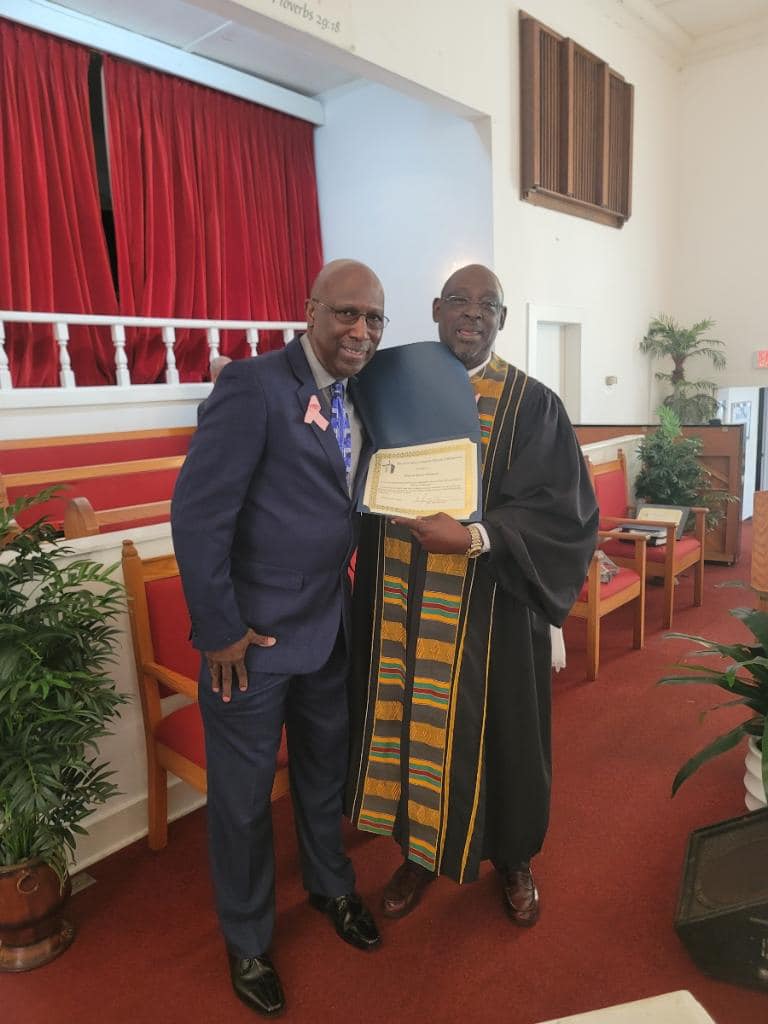 Pastor presenting a certificate of appreciation